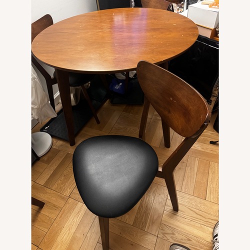 Used Sturdy Wooden Table with 4 Chairs for sale on AptDeco