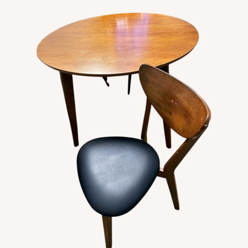 Used Sturdy Wooden Table with 4 Chairs for sale on AptDeco