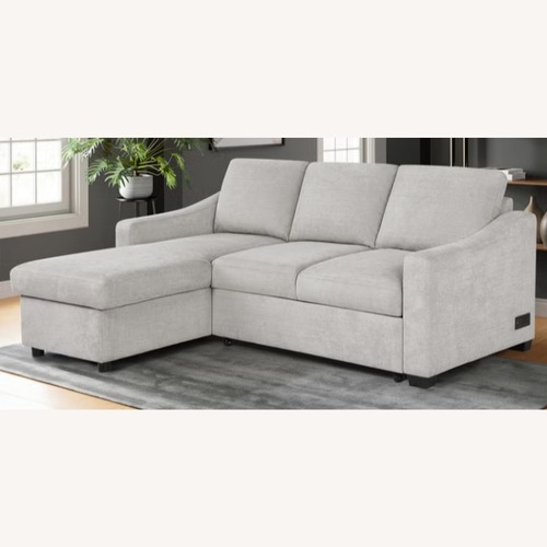 Used Costsco Beige Fabric Sleeper Sofa Chaise + Storage for sale on AptDeco