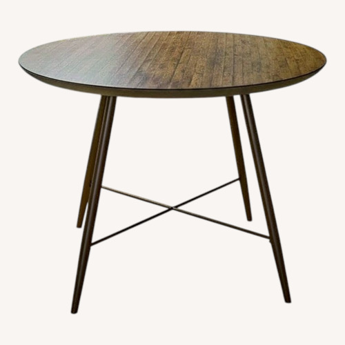 Used Keith Round Metal Base Dining Table for sale on AptDeco