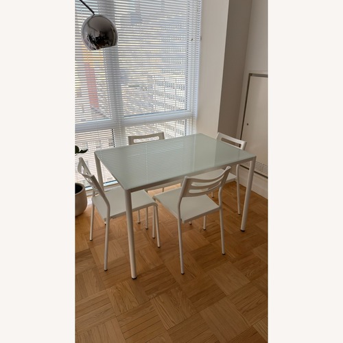 Used White Metal and Glass Dining Set for sale on AptDeco