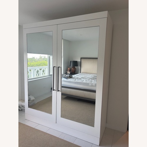 Used White Mirrored Wardrobe with 16 Pull-Out Drawers for sale on AptDeco