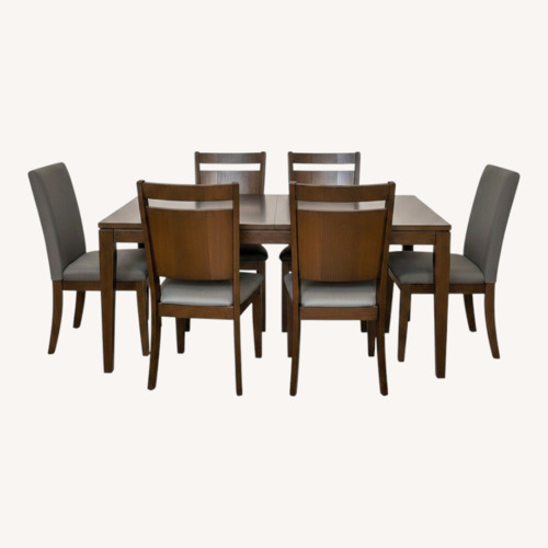Used Solid Wood Dining Set with 6 Chairs for sale on AptDeco