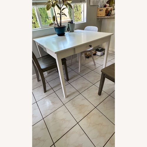 Used IKEA White Desk Table with Gray Chairs for sale on AptDeco