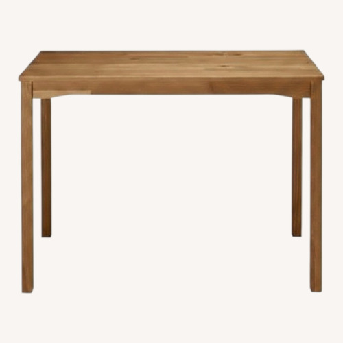 Used IKEA Natural Wood Dining Table for sale on AptDeco