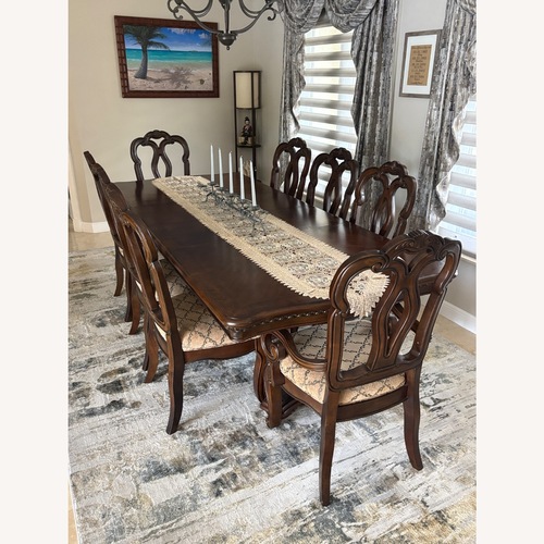 Used Dark Brown Wood Dining Set for sale on AptDeco