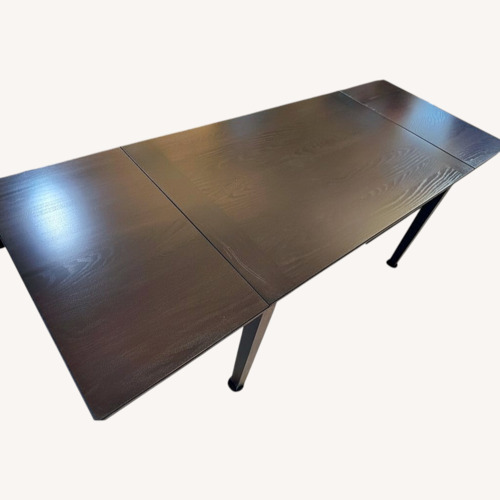 Used Dark Brown Dining Table for sale on AptDeco