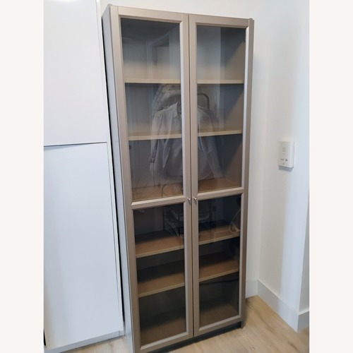 Used IKEA BILLY Bookcase with Glass Doors for sale on AptDeco