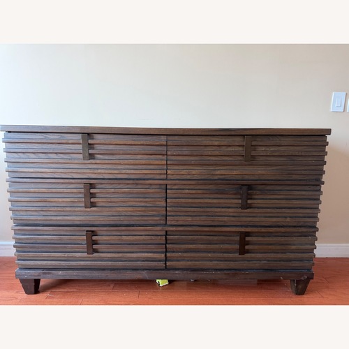 Used Raymour & Flanigan Dark Brown Wood Dresser for sale on AptDeco