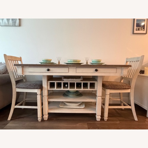 Used Aspen High Top Dining Set with 4 Chairs and Wine Rack for sale on AptDeco