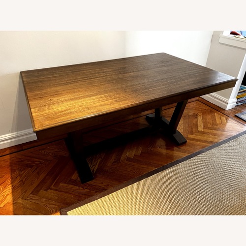 Used Dark Brown Wood Dining Table for sale on AptDeco
