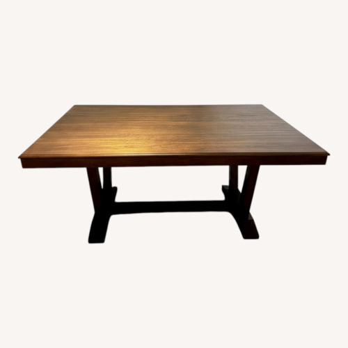 Used Dark Brown Wood Dining Table for sale on AptDeco