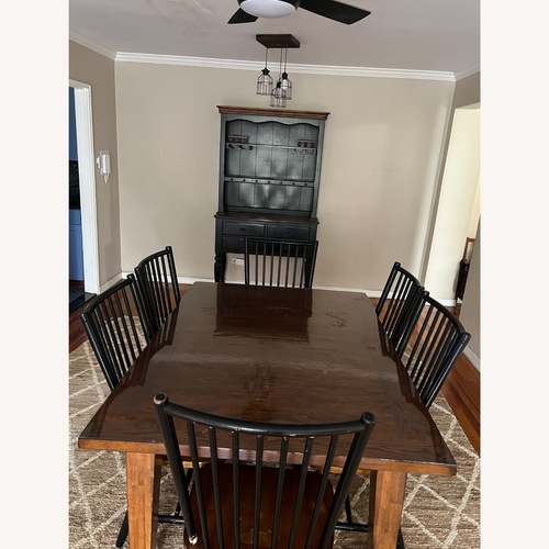 Used Dark Brown Wood Dining Table with 6 Chairs for sale on AptDeco