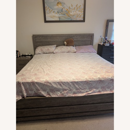 Used Ashley Furniture Light Gray Wood King Bed for sale on AptDeco