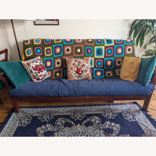 Used Vintage/Antique Dark Brown Wood Futon for sale on AptDeco