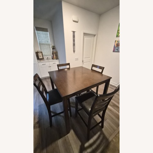 Used Ashley Bridson Counter Height Dining Table and Stool for sale on AptDeco