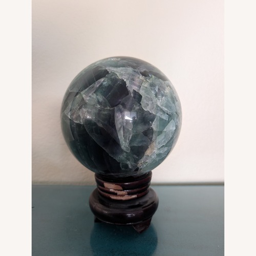 Used Fluorite Sphere on Rotating Rosewood Stand for sale on AptDeco