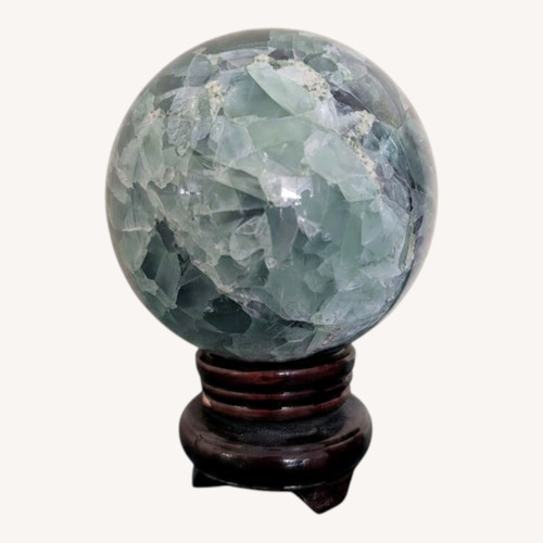 Used Fluorite Sphere on Rotating Rosewood Stand for sale on AptDeco