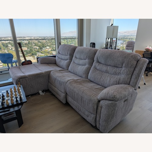Used Plush Power Reclining Sectional Sofa with Console for sale on AptDeco