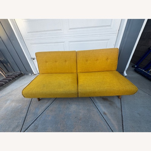 Used 9 by Novogratz Vintage/Antique Finds Yellow Fabric Futon for sale on AptDeco