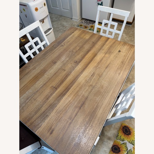 Used Light Brown Wood Dining Table for sale on AptDeco