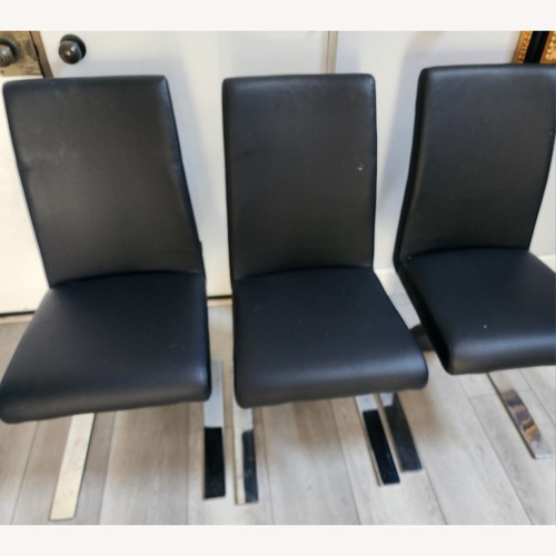 Used Zuri Black Dining Room Chairs Chrome Bases for sale on AptDeco