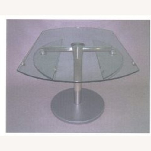 Used Glass and Stainless Steel Pedestal Dining Table for sale on AptDeco