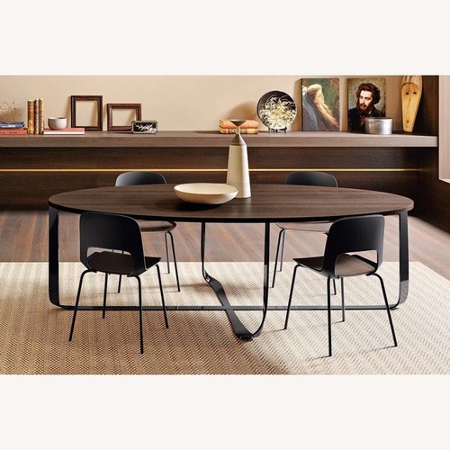 Used Burnt Oak Wood Oval W Gorgeous Titanium Base Table for sale on AptDeco