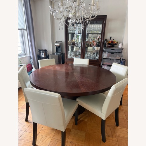 Used Crate & Barrel Orion 60" Round Walnut Dining Table for sale on AptDeco