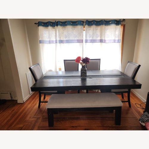 Used Cosmopolitan 6 Piece Black & Gray Upholstered Extendable Dining Set with Storage Bench for sale on AptDeco