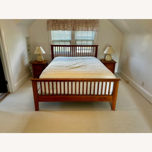 Used Light Brown Wood Queen Bed for sale on AptDeco