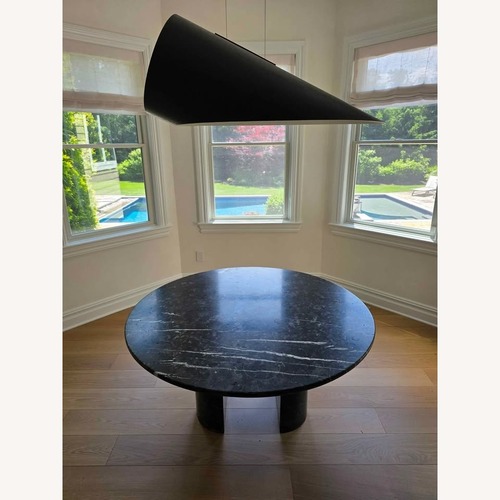 Used Circular 52-inch Black Marble Meta Dining Table for sale on AptDeco