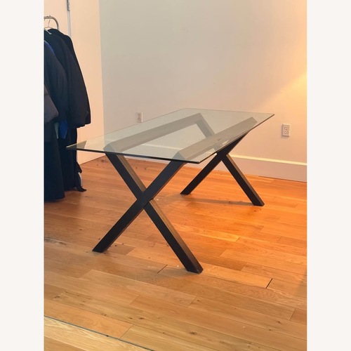 Used Modern Glass Dining Table with X Base for sale on AptDeco