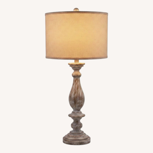 Used Signature Design Light Gray Resin Table Lamps for sale on AptDeco