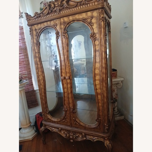 Used Vintage/Antique Finds Gold Wood Armoire for sale on AptDeco