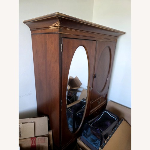 Used Vintage/Antique Finds Dark Brown Wood Armoire for sale on AptDeco