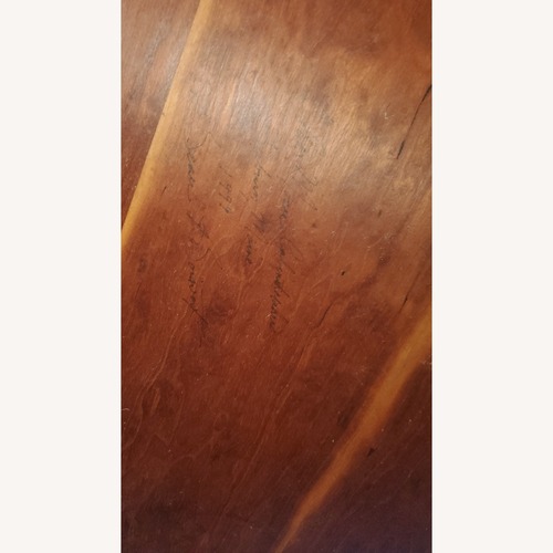 Used Dark Brown Wood Dining Table for sale on AptDeco