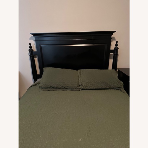 Used Black Wood King Bed for sale on AptDeco