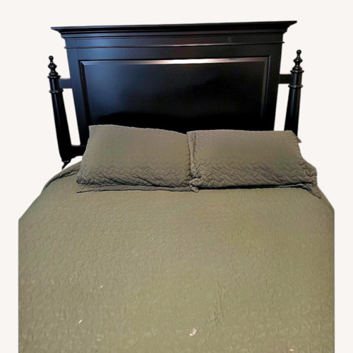Used Black Wood King Bed for sale on AptDeco