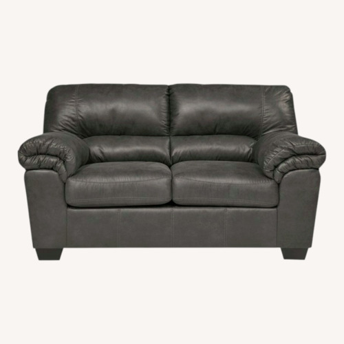Used Ashley Furniture Black Leather 2 Seater Sofa for sale on AptDeco
