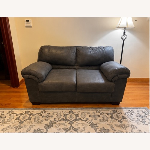 Used Ashley Furniture Black Leather 2 Seater Sofa for sale on AptDeco