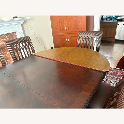 Used Dark Brown Wood Dining Set for sale on AptDeco