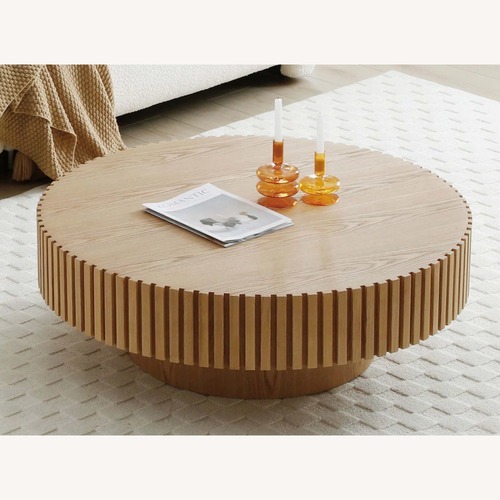 Used Amazon Round Pedestal Coffee Table with Ribbed Detailing for sale on AptDeco