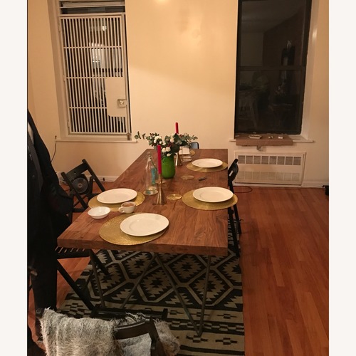 Used Solid Wood Acacia Dining Table for sale on AptDeco