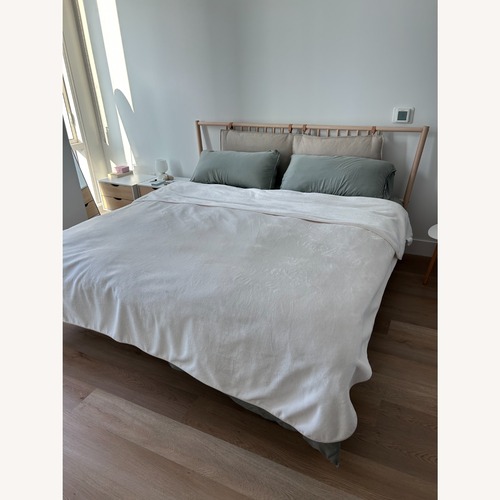 Used IKEA BJÖRKSNÄS Natural Wood King Bed for sale on AptDeco