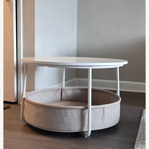 Used Round White Coffee Table with Storage Basket for sale on AptDeco