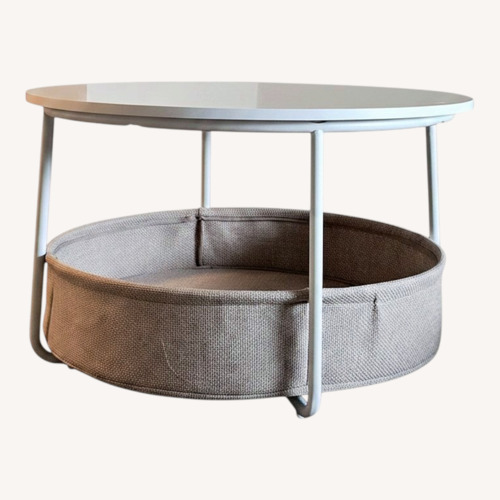 Used Round White Coffee Table with Storage Basket for sale on AptDeco