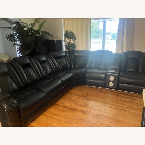 Used Black Leather Sectional  for sale on AptDeco