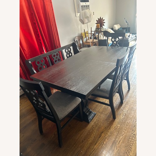 Used Dark Gray Wood Dining Set for sale on AptDeco