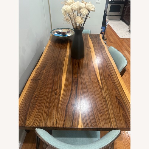Used Dark Brown Wood Dining Table for sale on AptDeco